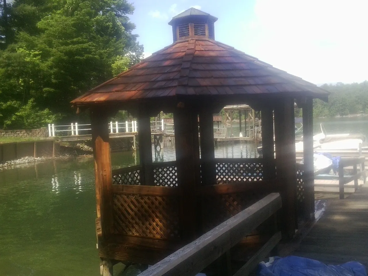 Cedar shake gazebo roof rebuilt on a lake dock in Porter Corners